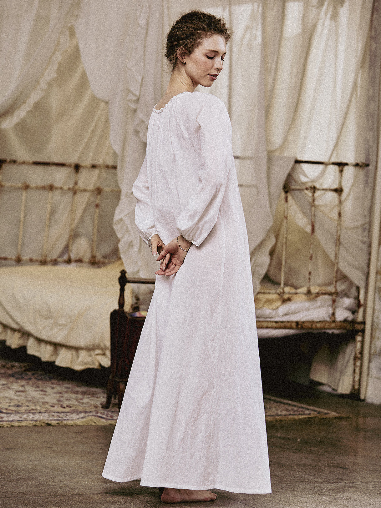 White Victorian nightgown for women with long sleeves and elegant lace trim