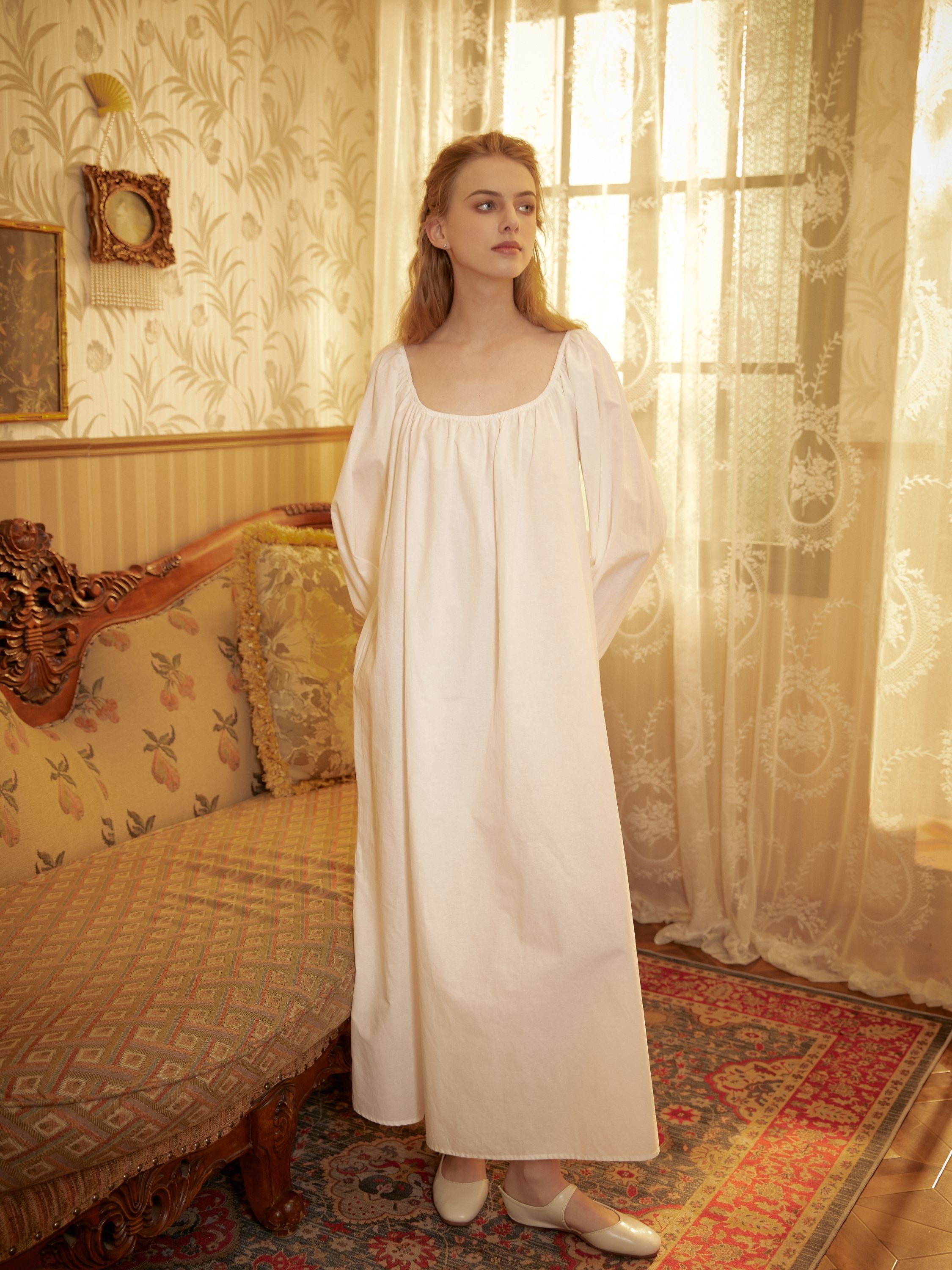 Full-length view of a handcrafted vintage nightwear for women made of premium white cotton.