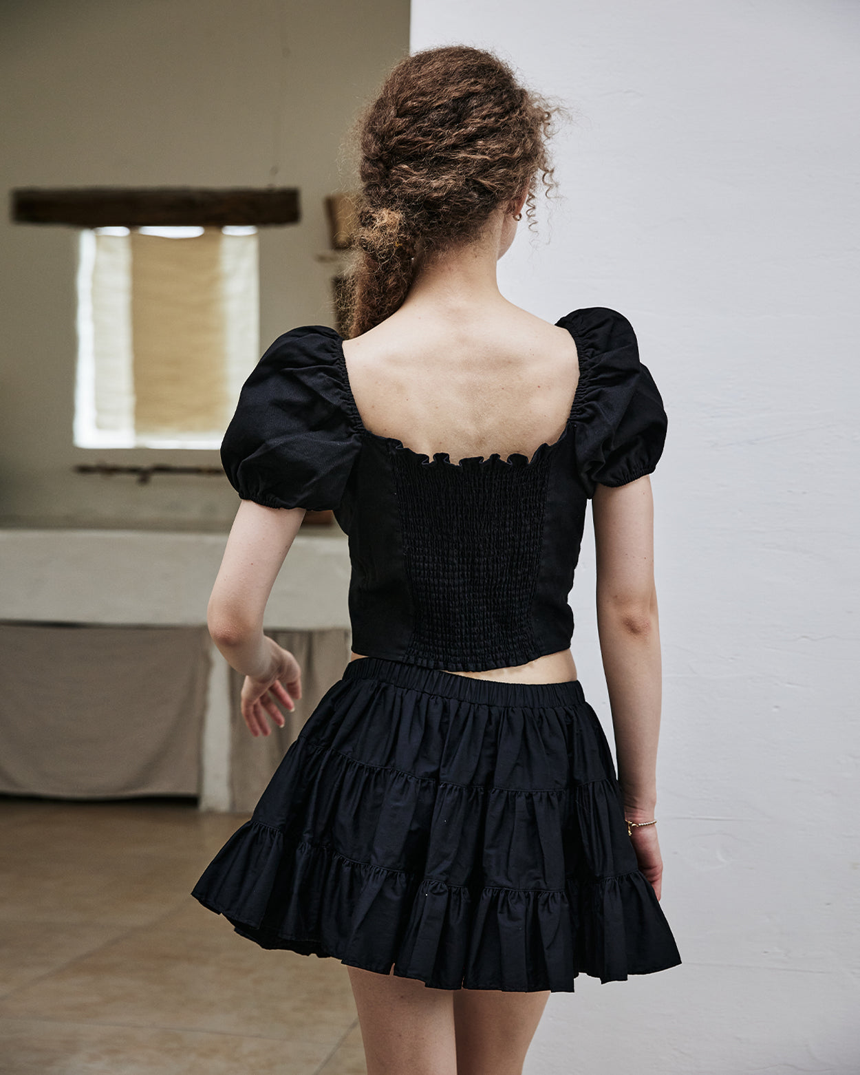 women's vintage cotton tiered skort worn with casual top - back view