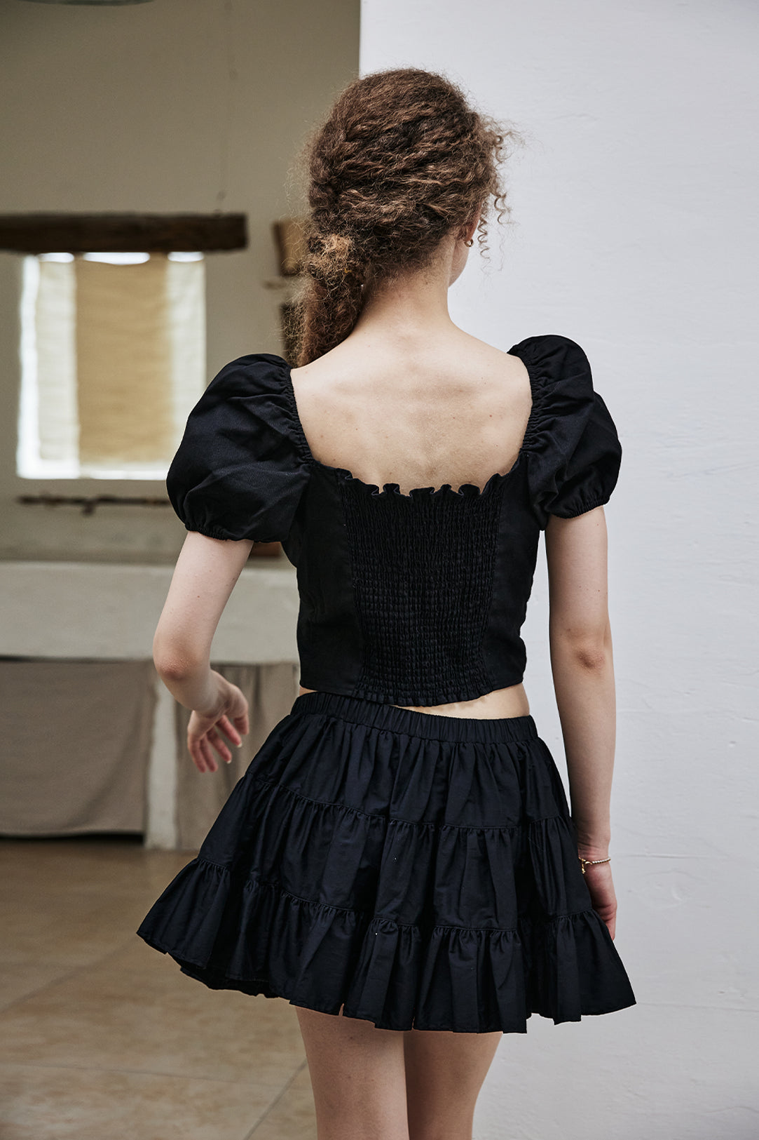 women's vintage cotton tiered skort worn with casual top - back view