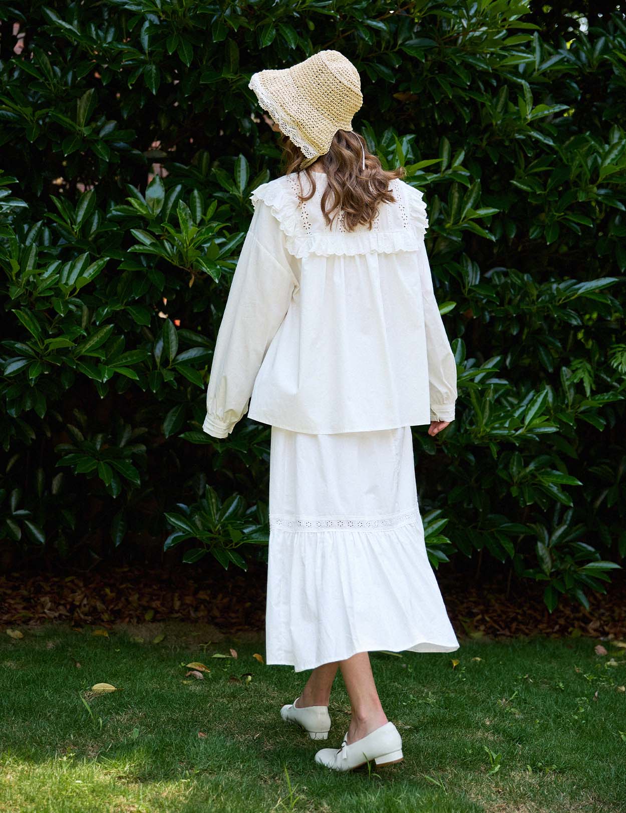 Sueasyretro breathable white cotton ruffle skirt with lace details. Ideal for outdoor rustic vintage aesthetic outfits, back view.