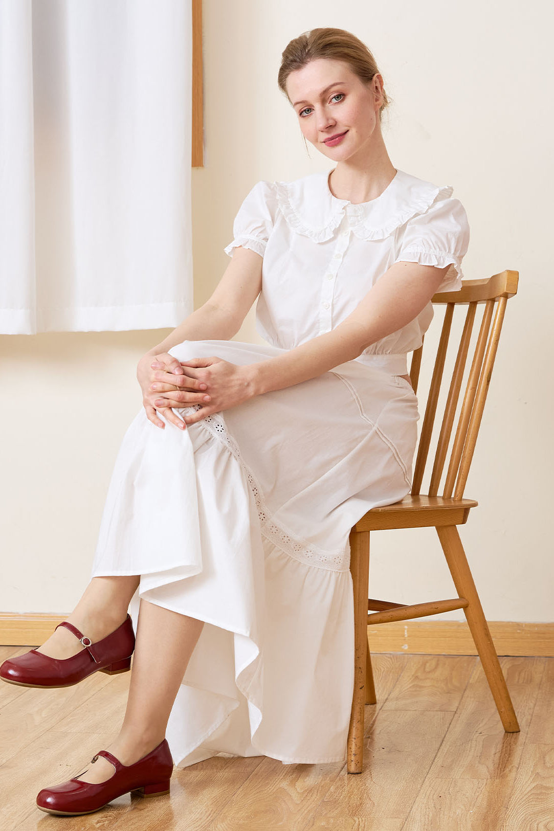Sueasyretro white 100% cotton midi skirt with ruffle hem, sitting pose.