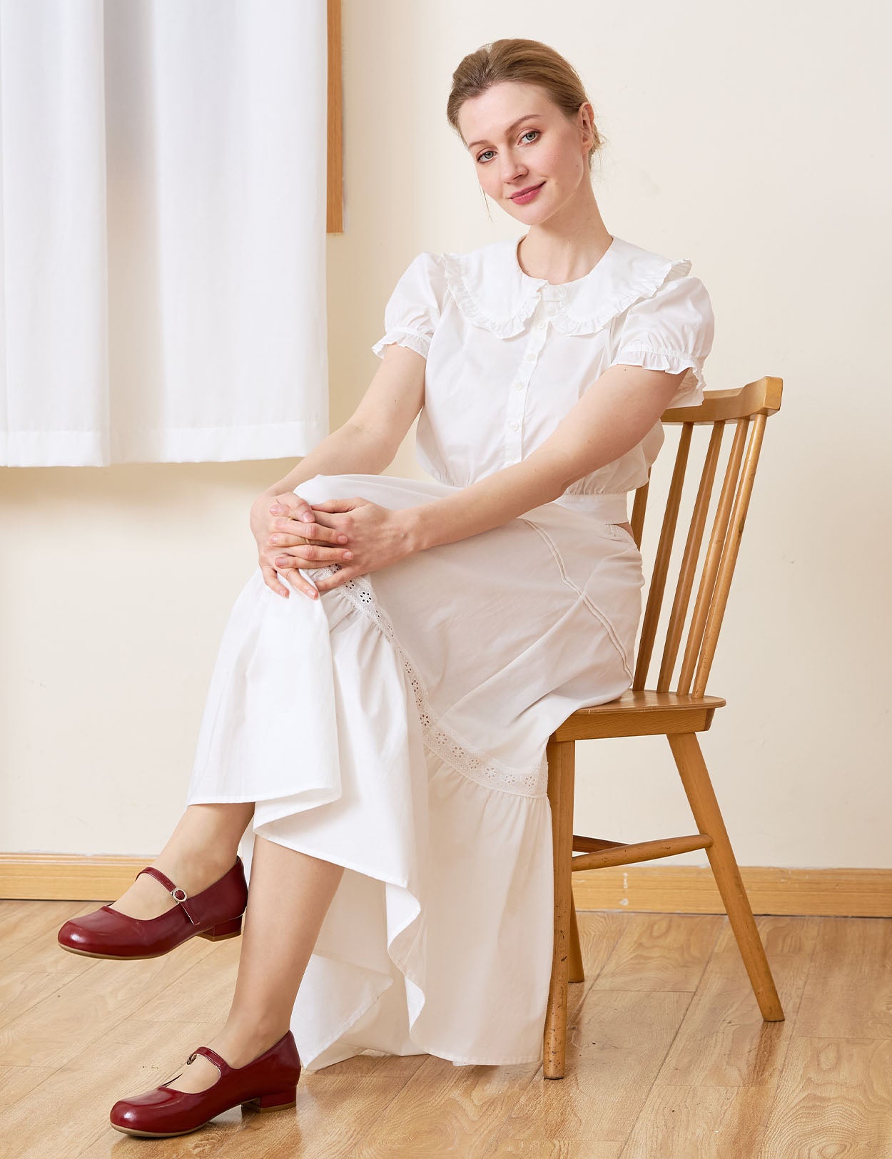 Sueasyretro white 100% cotton midi skirt with ruffle hem, sitting pose.
