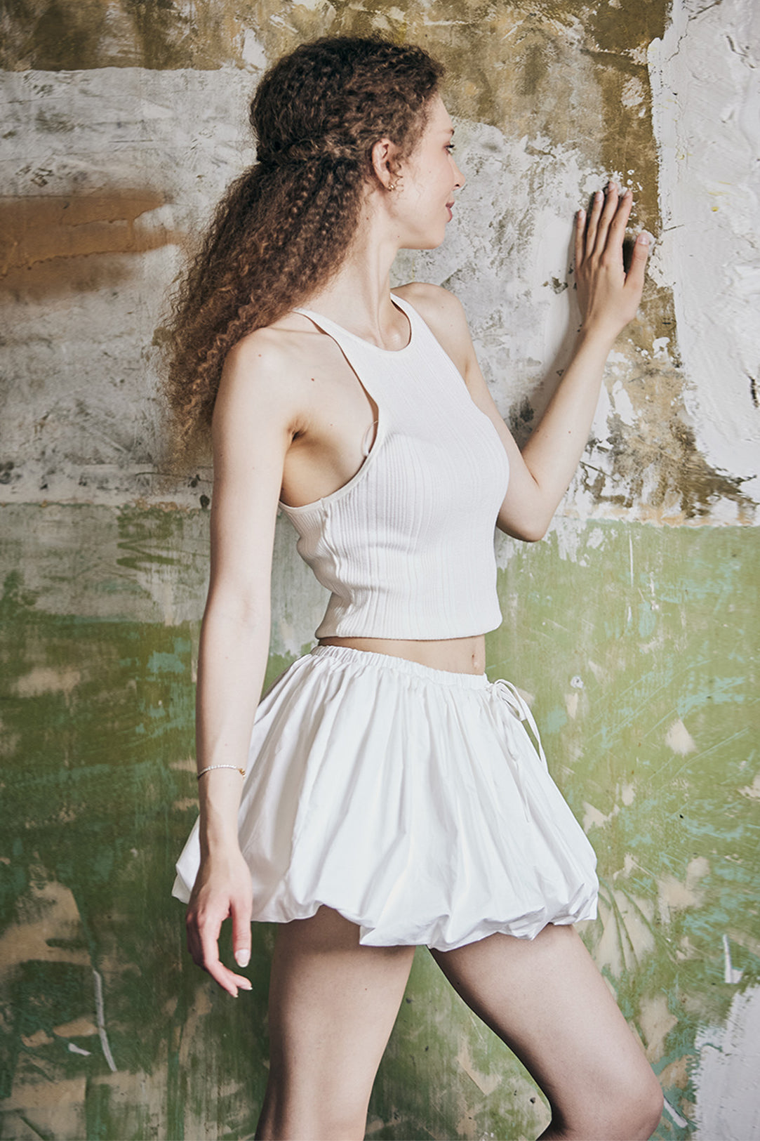women's white cotton bubble skort showing fabric texture and pleated construction