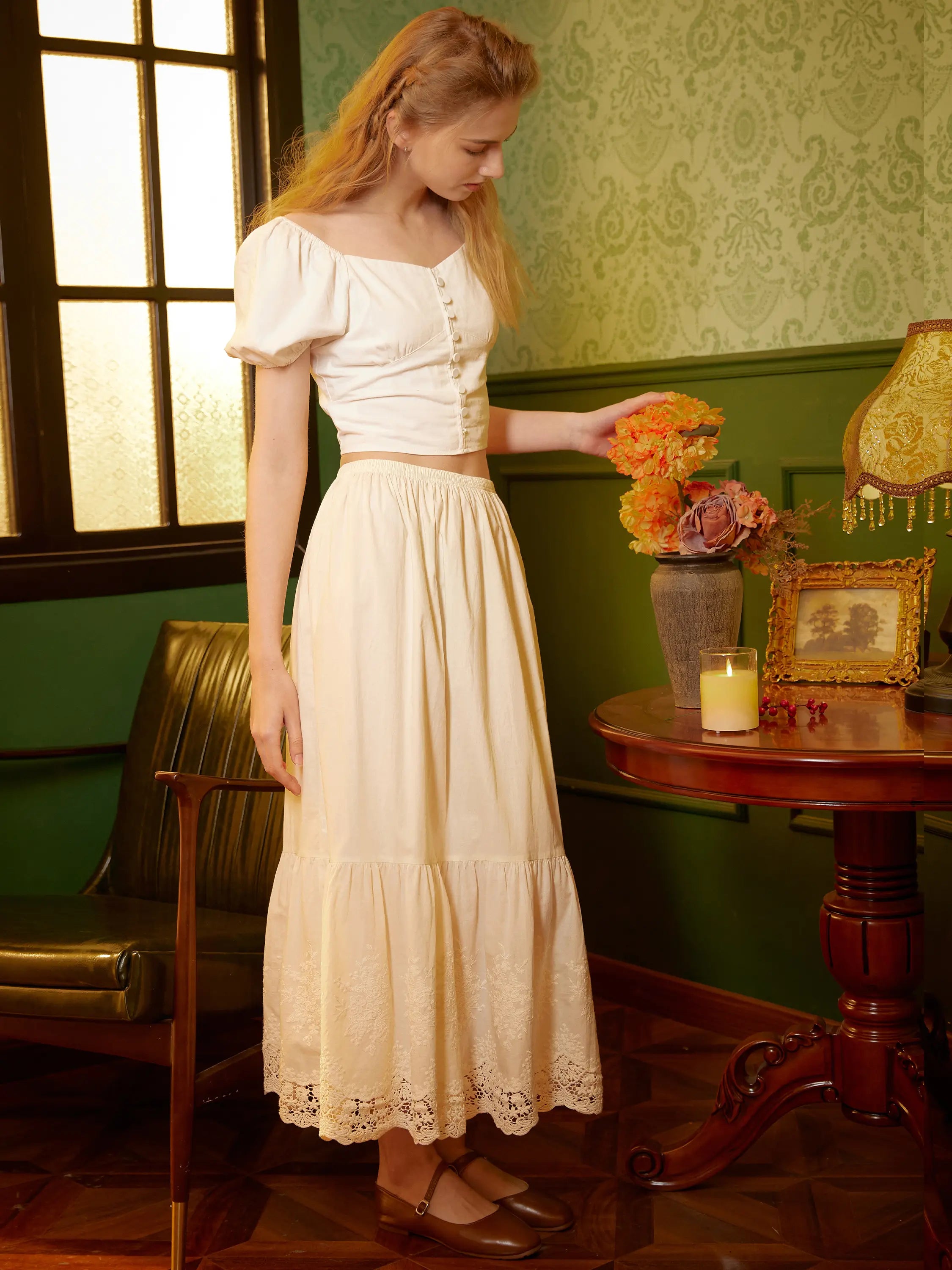 Sueasyretro cottagecore two-piece outfit featuring a white sweetheart neck puff-sleeve crop top and a matching a-line tiered petticoat with embroidered floral lace hem.