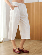 Woman wearing white 100% cotton wide-leg cropped pants
