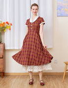 Sueasyretro cream lace skirt extender layered under a plaid midi dress for added length.