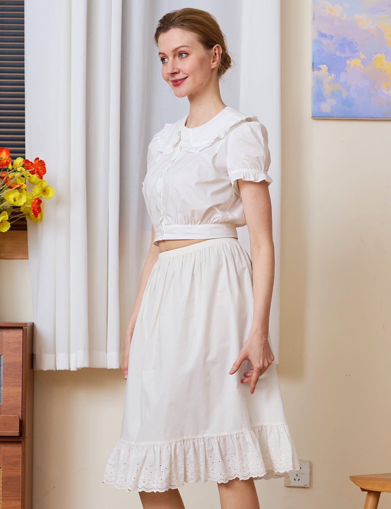 Elegant white cotton petticoat with nostalgic charm, featuring anti-cling fabric and delicate eyelet lace detailing.