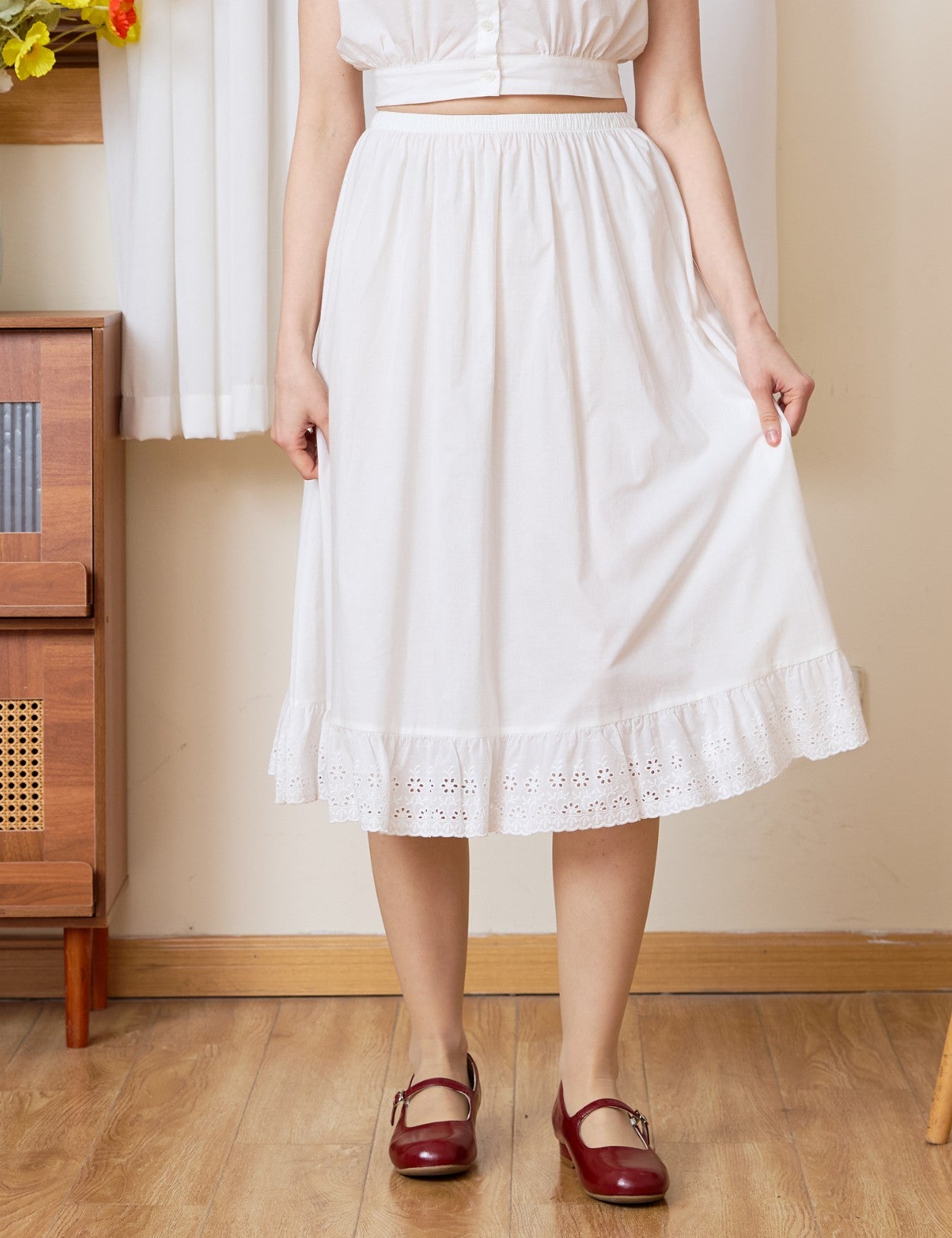 Front view of the Sueasyretro cotton Petticoat. A classic white half slip with a unique medallion lace edge.