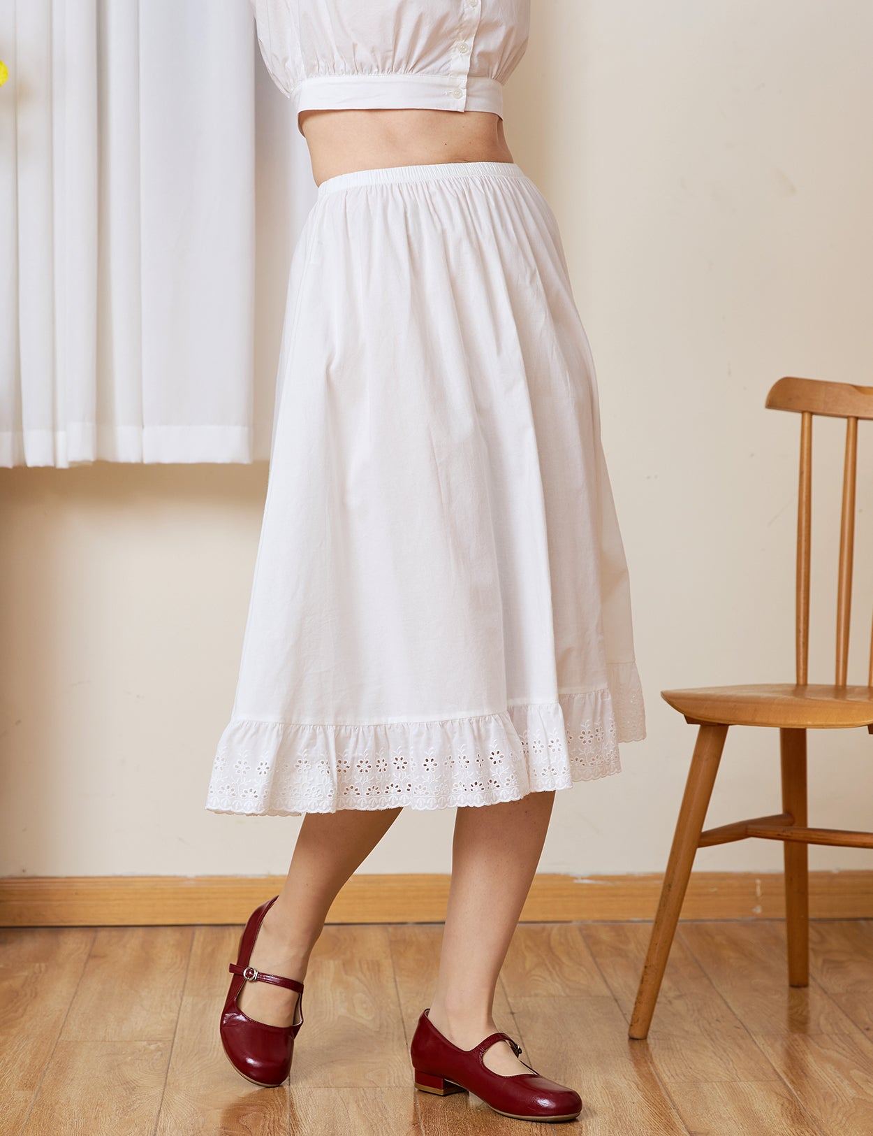 Side profile of the long half slip. A static-free cotton Petticoat with a geometric medallion lace edge.