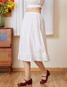 Side profile of the long half slip. A static-free cotton Petticoat with a geometric medallion lace edge.
