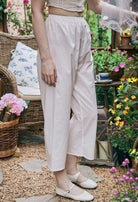 Side close-up of Sueasyretro white bloomer pants with delicate lace hem, comfortable cotton Pajamas Pants for lounging.
