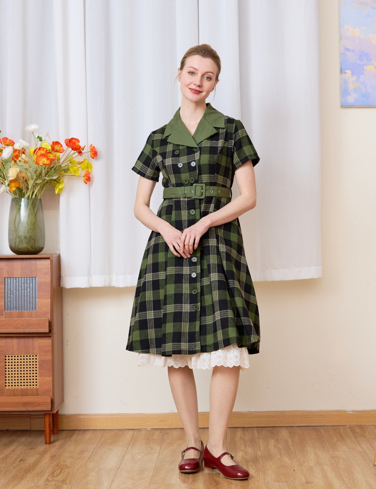 Cream cotton petticoat layered elegantly under a plaid dress, showcasing the classic English trellis lace hem peeking out.