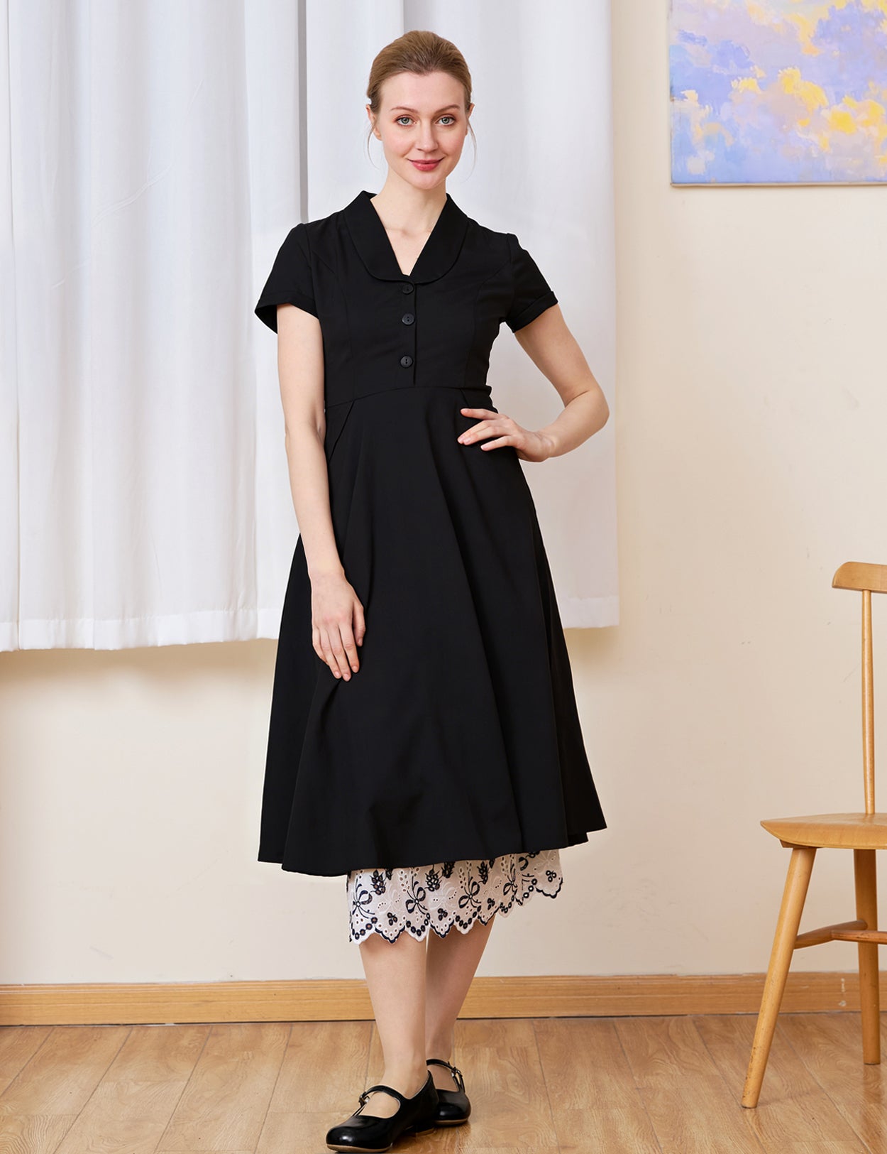  White cotton Petticoat with bluework hem layered perfectly under a solid black dress.
