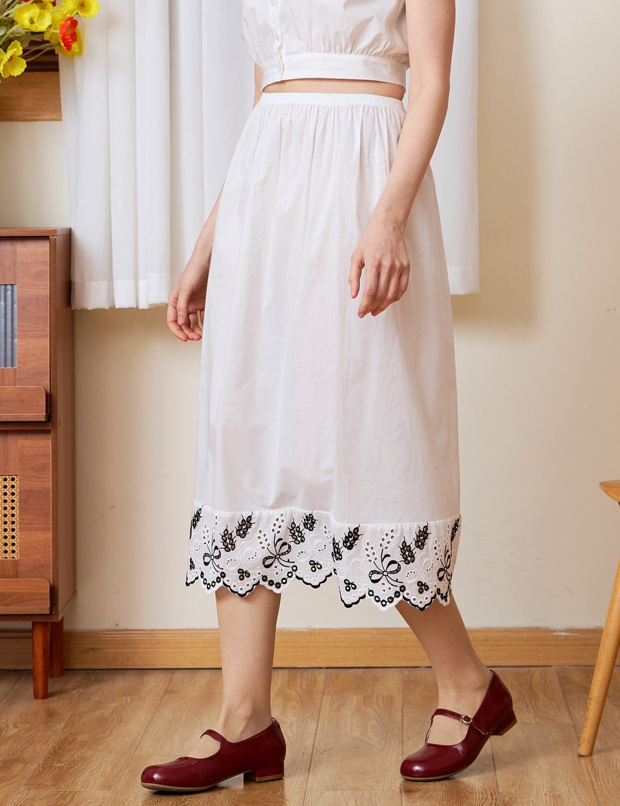 Waist-down view of the white cotton Petticoat, designed to feature Tudor bluework.
