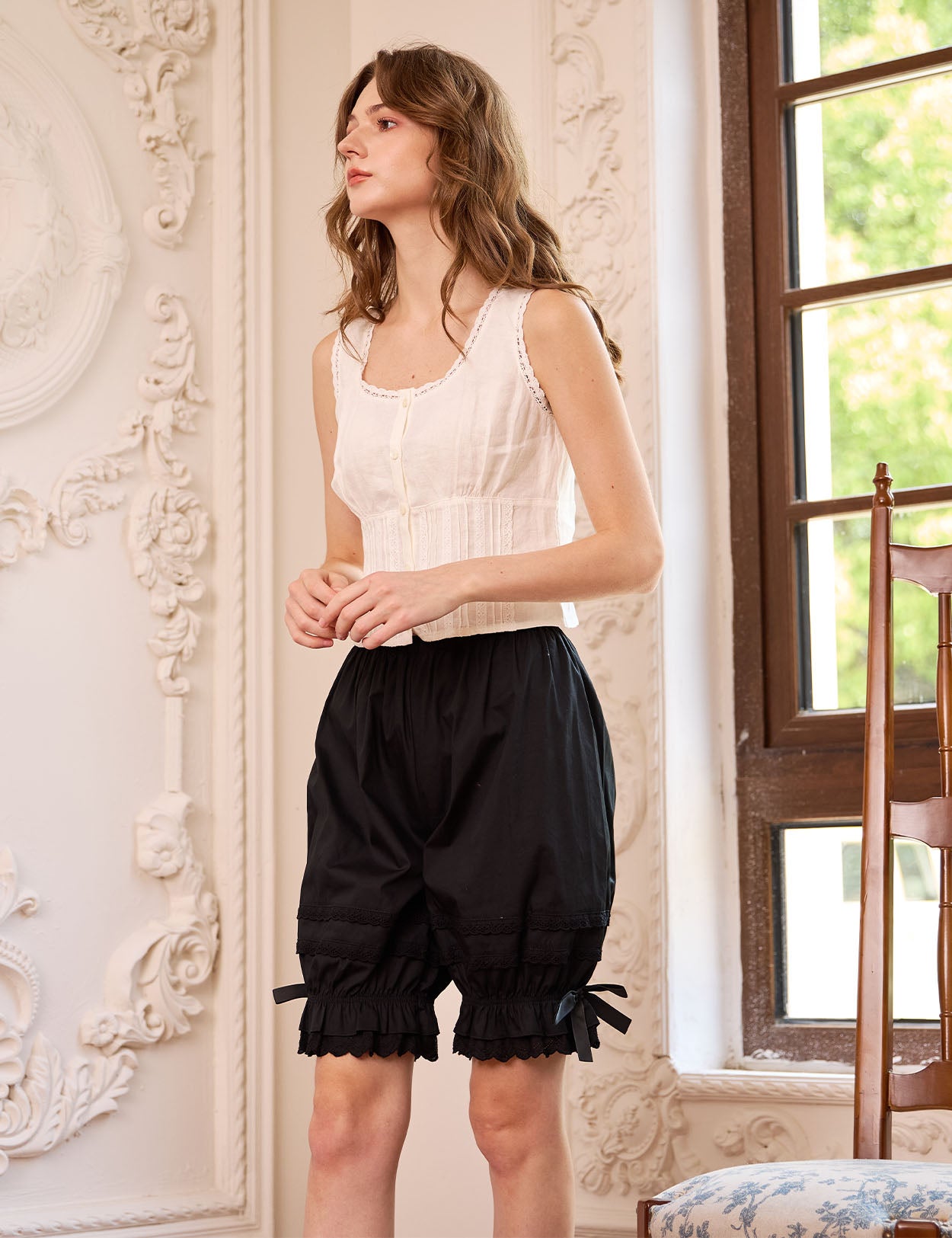 Black vintage lace cotton bloomers for women. These soft bloomer pants feature ruffled cuffs and satin bow details.