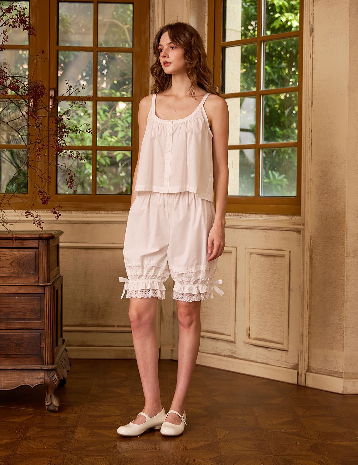 Vintage style cotton bloomers for women in ivory, in a retro style room. 