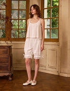 Vintage style cotton bloomers for women in ivory, in a retro style room. 