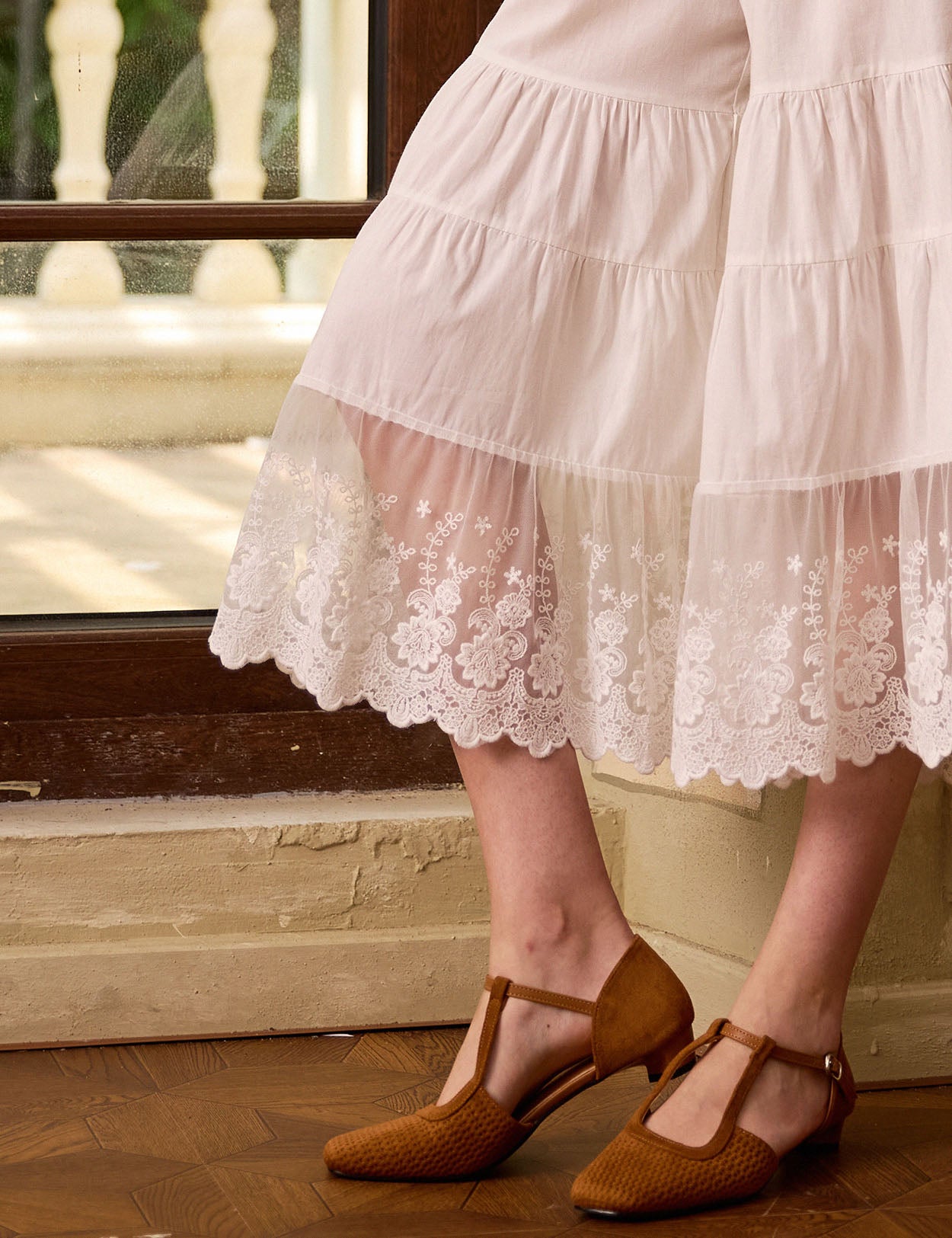 Close-up of the scalloped floral lace hem on Sueasyretro white bloomer pants. Perfect vintage style detail.