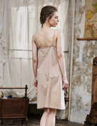Women's nude cotton full slip with spaghetti straps, showing comfortable fit and classic design - back view
