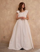 Full length view of Sueasyretro ivory Victorian nightgown. A roomy, voluminous cotton nightie with romantic lace hem.