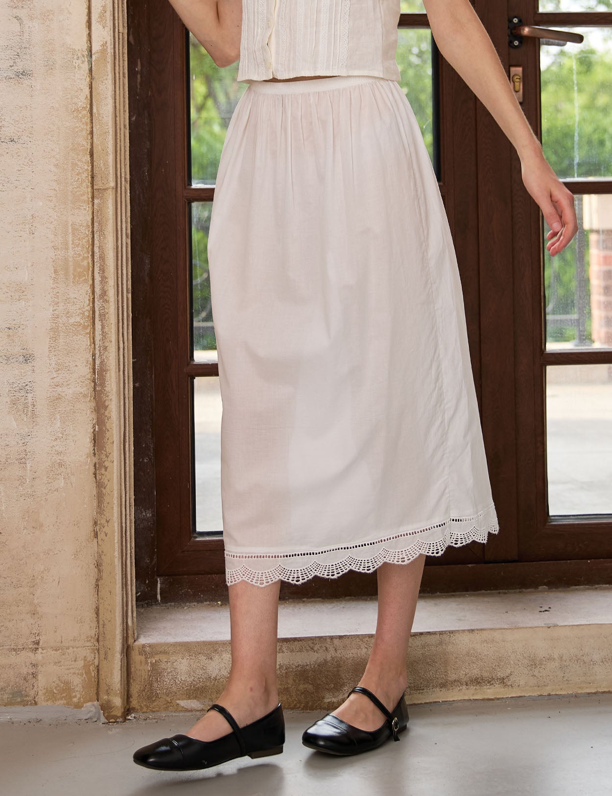 Side view of Sueasyretro midi length ivory cotton petticoat, highlighting the A-line shape and vintage lace trim.