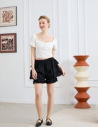 easyretro Black Cotton Ruffle Bloomer Shorts. Front view of model wearing the shorts and matching top.