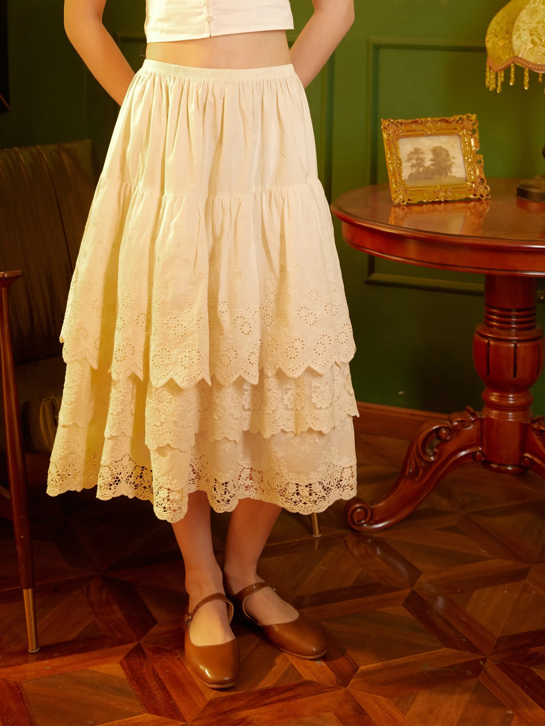 Ivory cotton petticoat half slip with tiered eyelet lace trim, vintage-style layered silhouette worn with a cropped cotton top