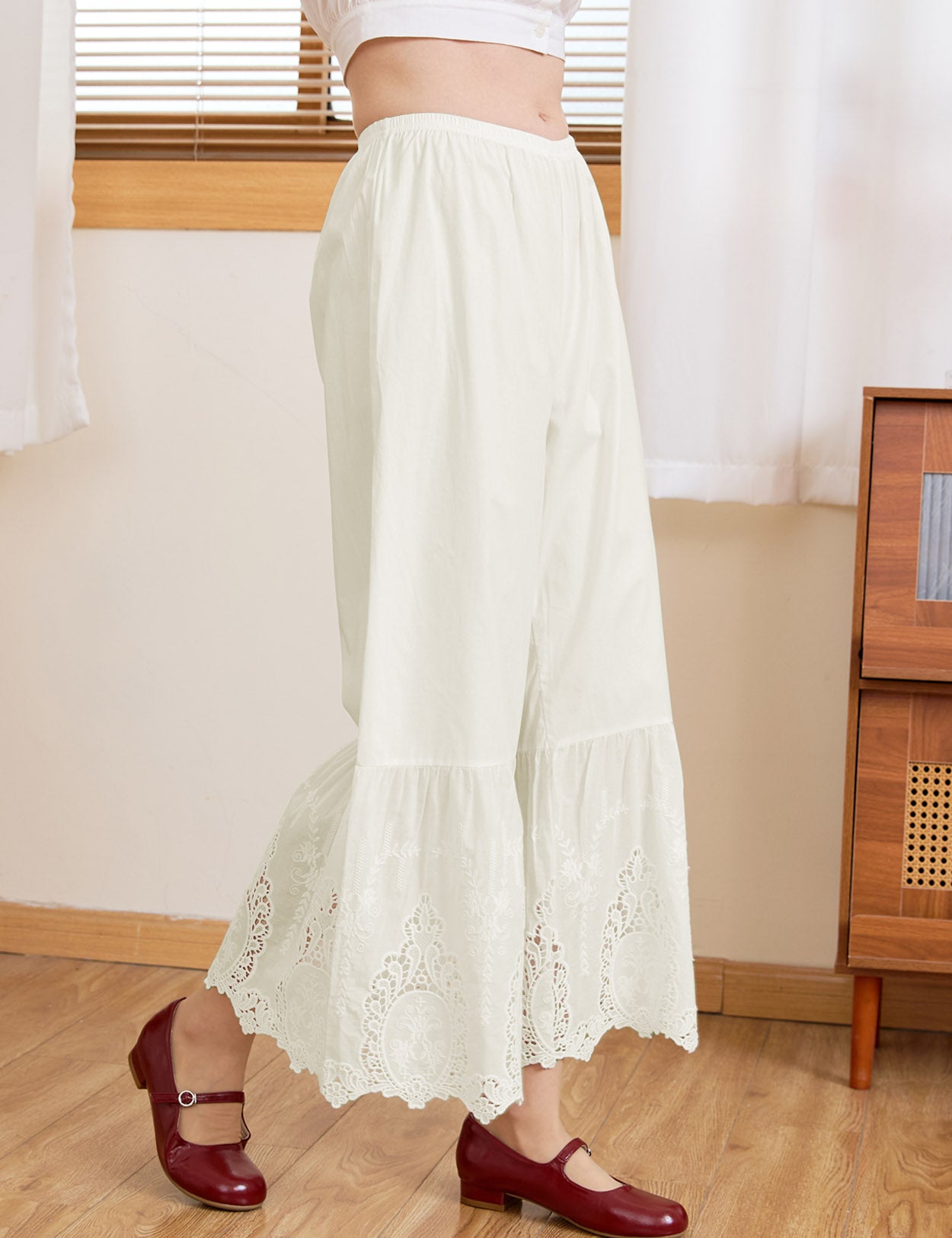 Close-up of intricate Broderie Anglaise mirror motif lace on Sueasyretro cream cotton bloomers.