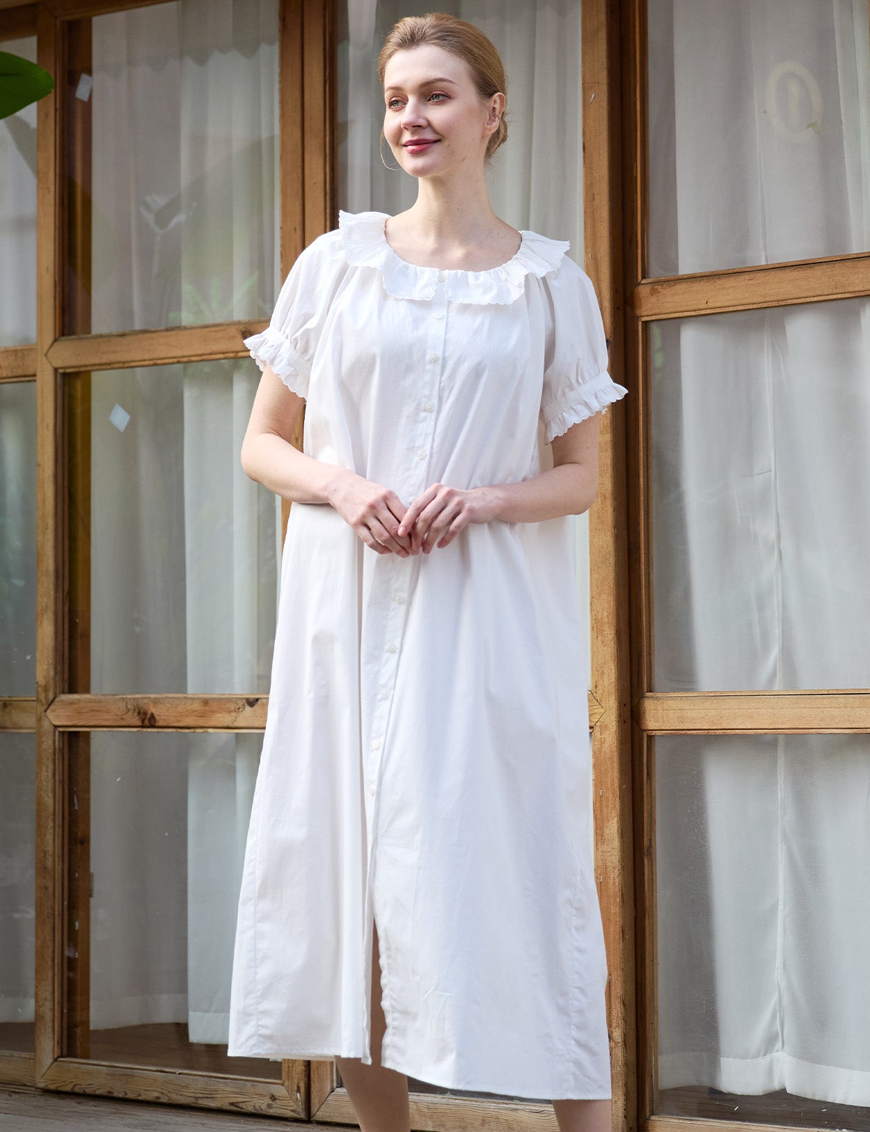 Full length of a white Sueasyretro vintage house dress in pure cotton