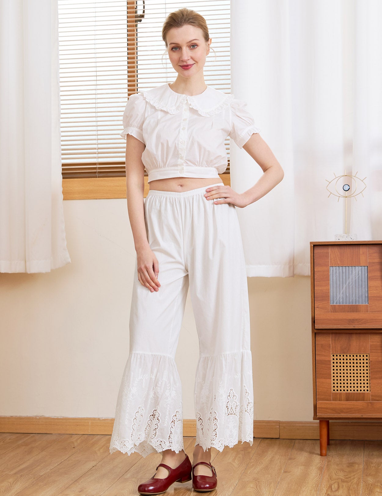 Model wearing Ivory Sueasyretro 100% Cotton Lace Bloomers and red Mary Janes.