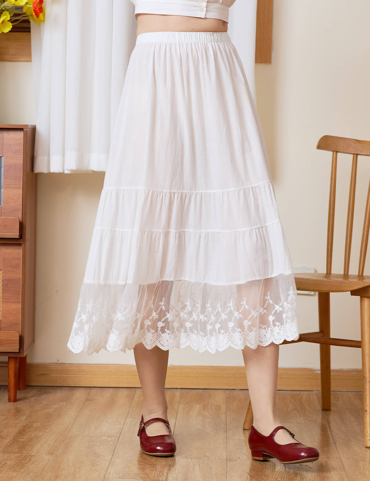 Front view of Sueasyretro white cotton A-line skirt extender featuring a beautiful tiered lace hem.