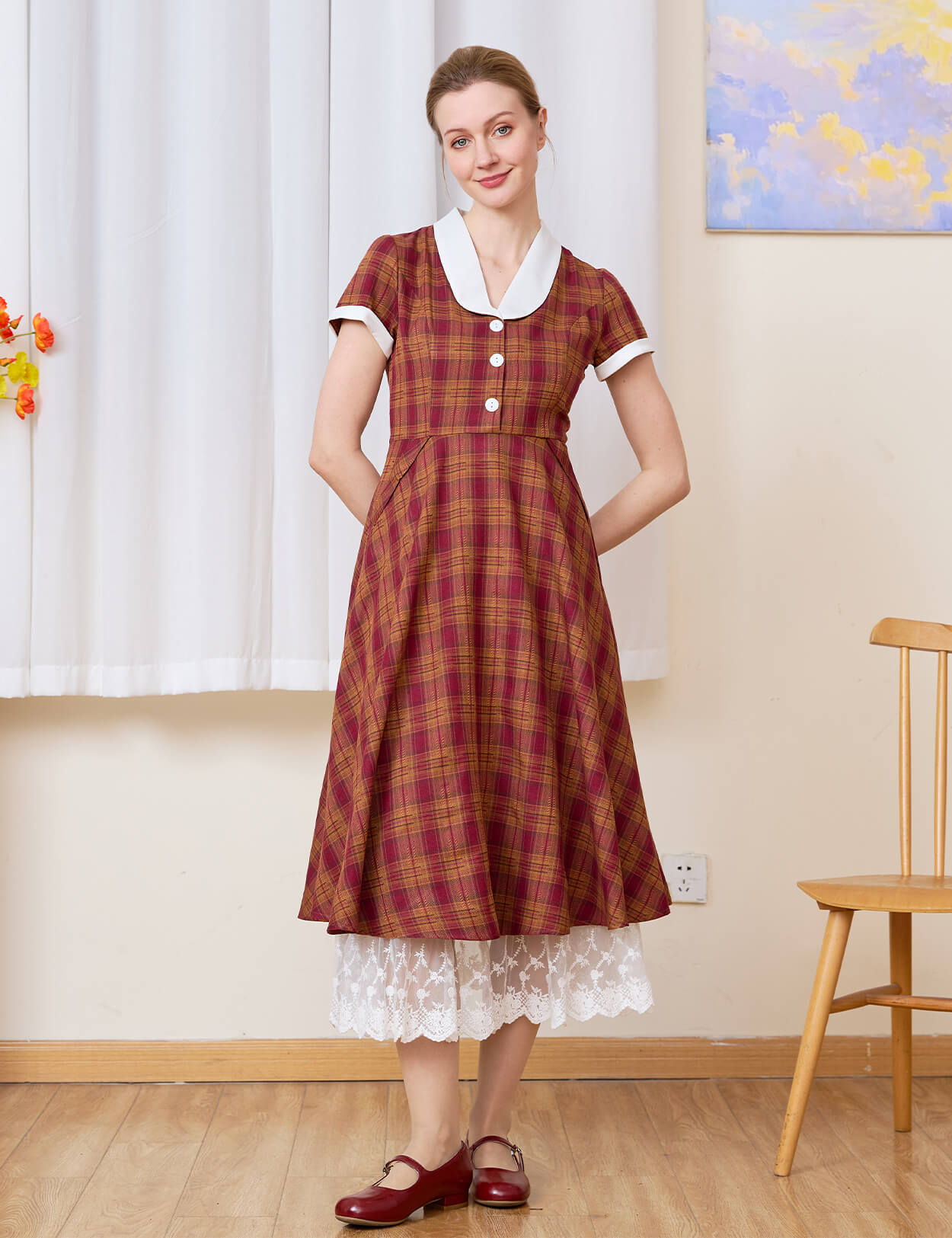 Sueasyretro cotton A-line skirt extender with tiered lace layered under a red plaid midi dress.