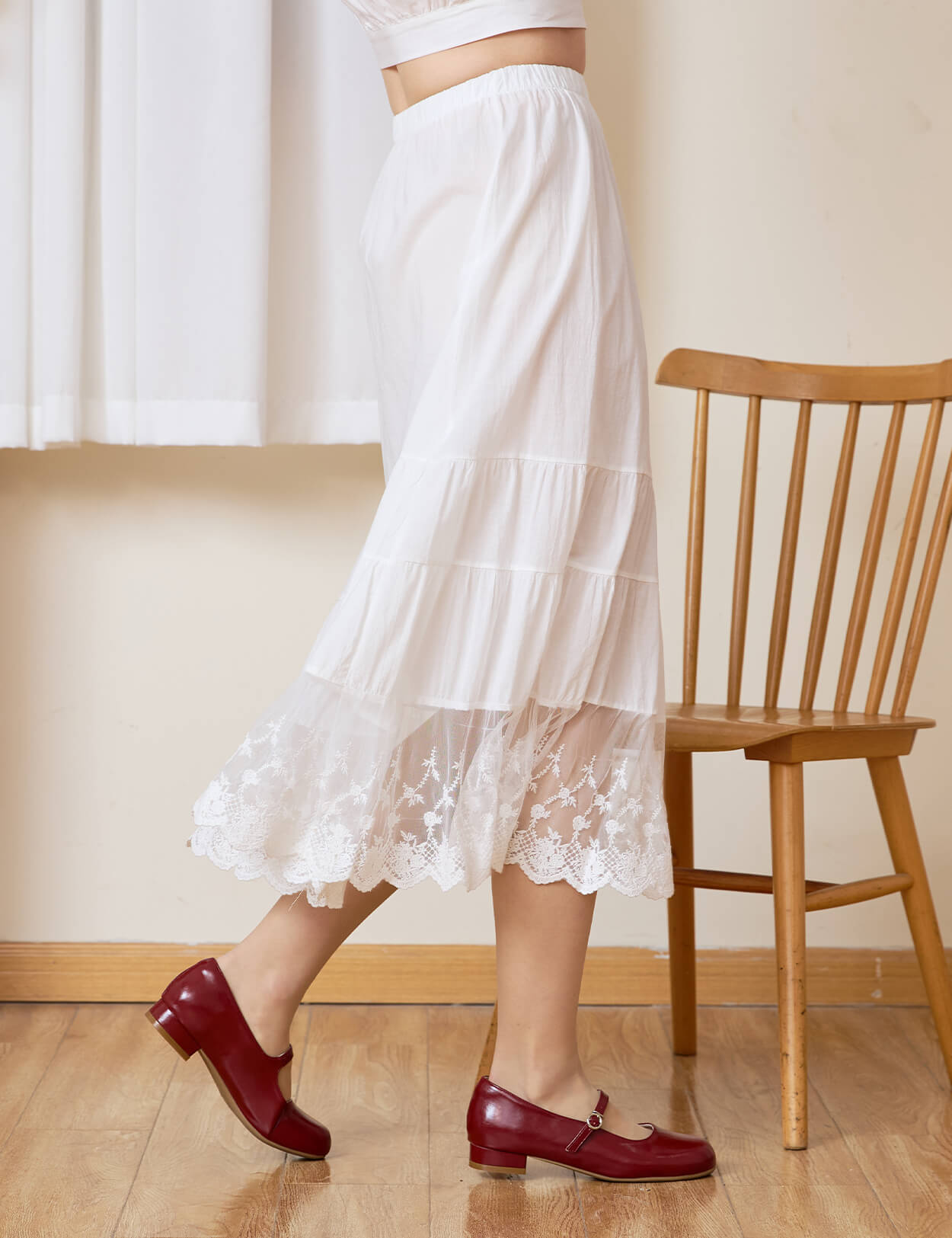 Side view of Sueasyretro A-line skirt extender showing the beautiful drape of the tiered lace hem.