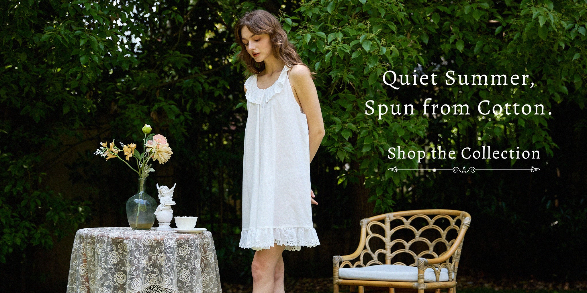 A woman wearing a Sueasyretro vintage pure cotton white summer nightgown with an eyelet hem, standing in a rustic garden setting. Text reads: "Quiet Summer, Spun from Cotton."