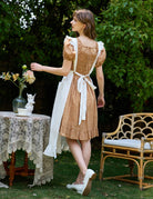 Back view of Victorian cotton pinafore apron showing long sash tie at waist