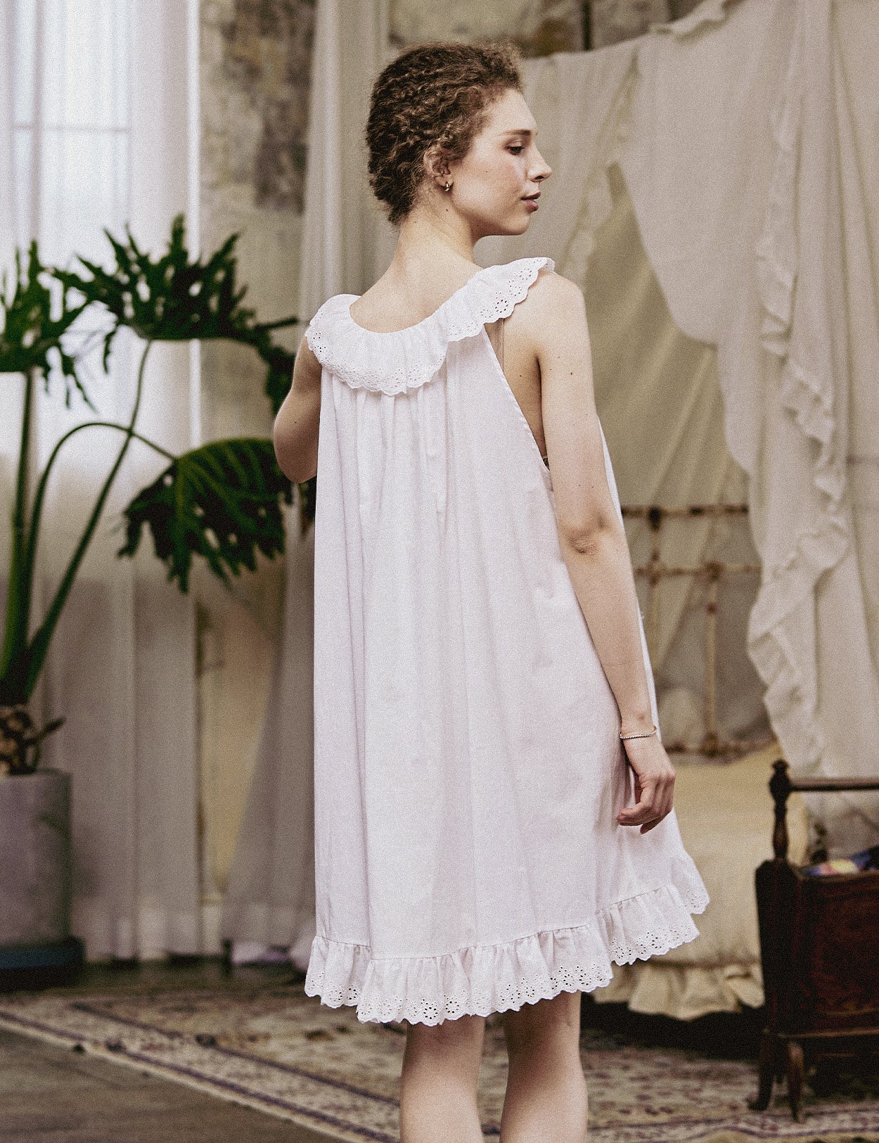 Back view of the Victorian-style nightgown showing the elegant scoop back and ruffled lace collar.