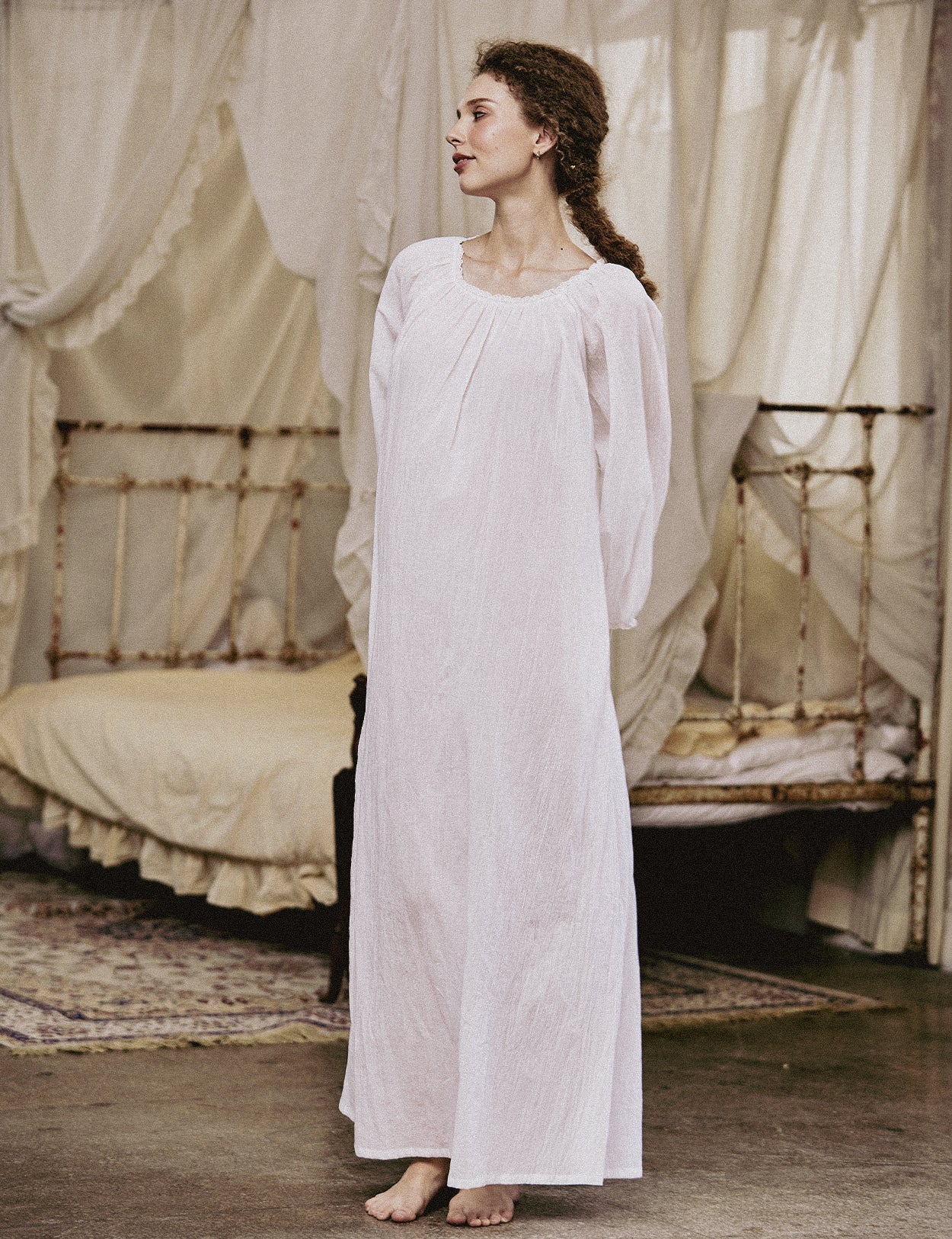 White Victorian nightgown for women with long sleeves and elegant lace trim