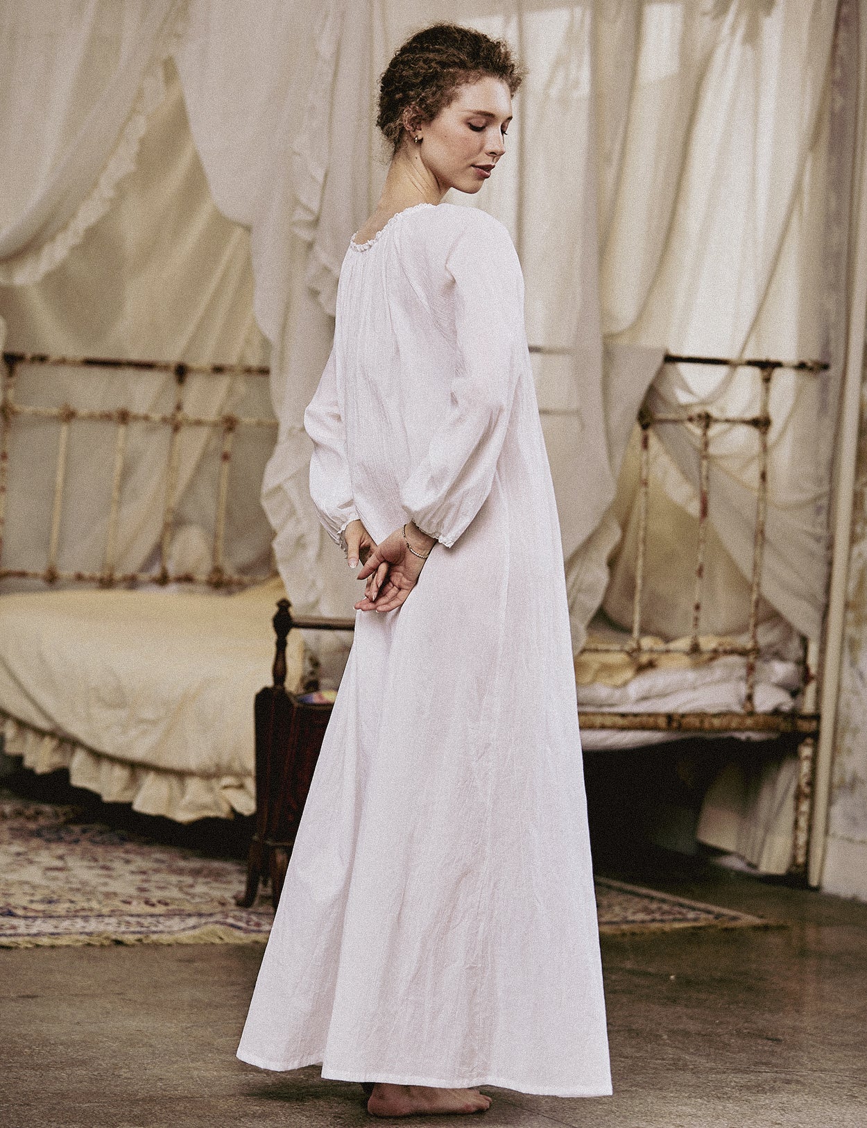 White Victorian nightgown for women with long sleeves and elegant lace trim