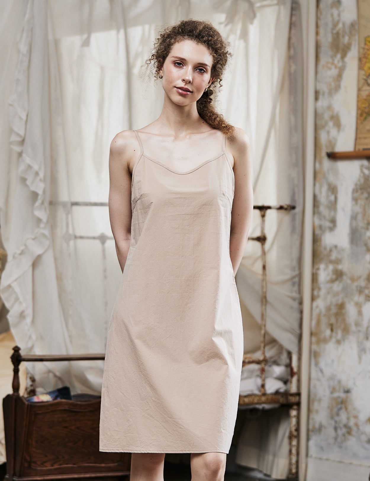 Women's nude cotton full slip with spaghetti straps, showing comfortable fit and classic design