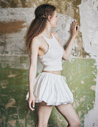 women's white cotton bubble skort showing fabric texture and pleated construction
