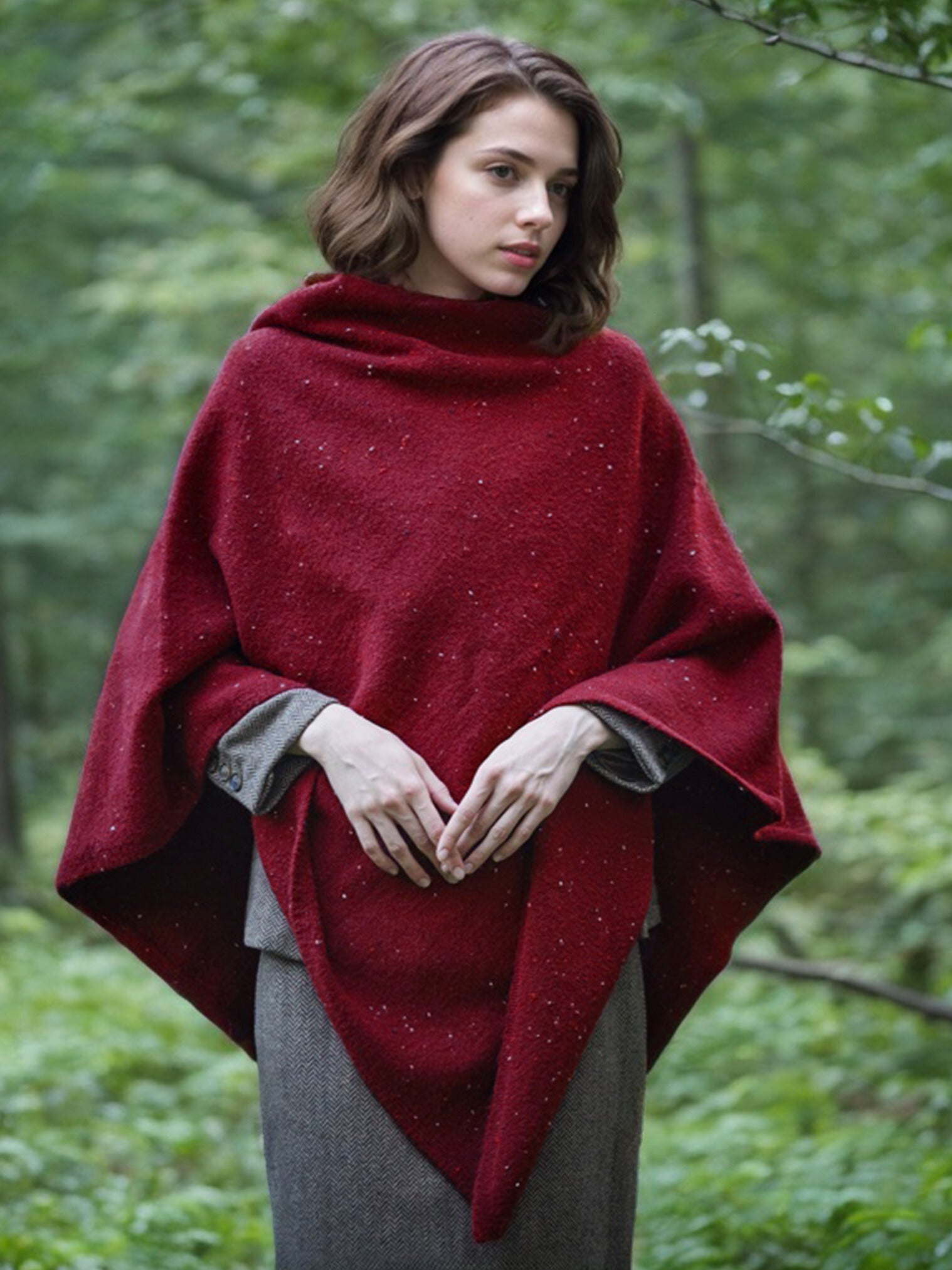 Women's knit wool poncho in tweed speckled pattern